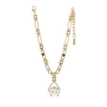 Load image into Gallery viewer, Elevate your ensemble to celestial levels with the Adhara Necklace! This sparkly stunner is crafted with an antique gold-plated brass base, a 14.5&quot; chain with a 3&quot; extension, and high-quality crystals. The round drop is a pink champagne crystal while the gold link chain, unique in its own right, adorns two black flowers and two clear crystal flowers. Truly out of this world, made with love in Canada!
