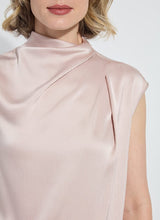 Load image into Gallery viewer, Close-up of model wearing light pink sleeveless top against a white background.
