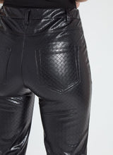 Load image into Gallery viewer, Close-up of back pockets on a black wicker textured faux leather pant worn by a model against a white background

