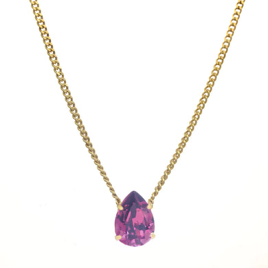 Introducing the Lumi necklace, a dazzling and versatile piece adorned with a high-quality pear-shaped stone in the middle. This antique gold-plated necklace features a 14” length with a 3” extension. Handcrafted in Canada.    Color- Gold and amethyst. Premium crystals. Tear drop in amethyst. Gold chain. Length- 14 inches with 3-inch extension. 