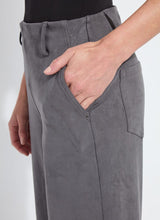 Load image into Gallery viewer, Close-up of model wearing grey pants against a white background.
