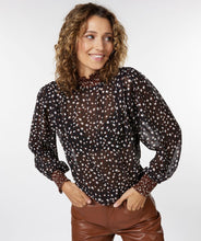 Load image into Gallery viewer, This brown, smocked long sleeve blouse, featuring swirling circles known as &quot;Animal Steps,&quot; is a fashionable piece that can be dressed up or down depending on the occasion. Its unique design offers a chic and stylish look. Color-Brown, black, brown. Button back closure. Smocked neck and sleeves. Slightly sheer. Suggest wearing a black bra or black cami underneath.
