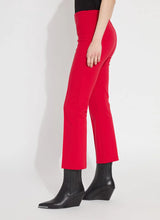 Load image into Gallery viewer, The Ankle Elysse, with its shorter 27.5-inch inseam, is an ideal fit-and-flare pant for shorter women. Crafted from 4-way stretch Ponte fabric, it gracefully contours the hips and thighs, then flares at the leg. Featuring a concealed patented waistband and front pintucks, its stunning deep red hue is sure to make a statement.
