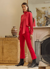 Load image into Gallery viewer, The Ankle Elysse, with its shorter 27.5-inch inseam, is an ideal fit-and-flare pant for shorter women. Crafted from 4-way stretch Ponte fabric, it gracefully contours the hips and thighs, then flares at the leg. Featuring a concealed patented waistband and front pintucks, its stunning deep red hue is sure to make a statement.
