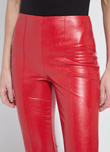 Load image into Gallery viewer, Close-up of model wearing red faux leather pants against a white background.
