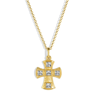 Gold cross necklace with embedded crystals against a white background.