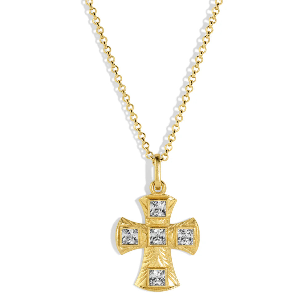 Gold cross necklace with embedded crystals against a white background.