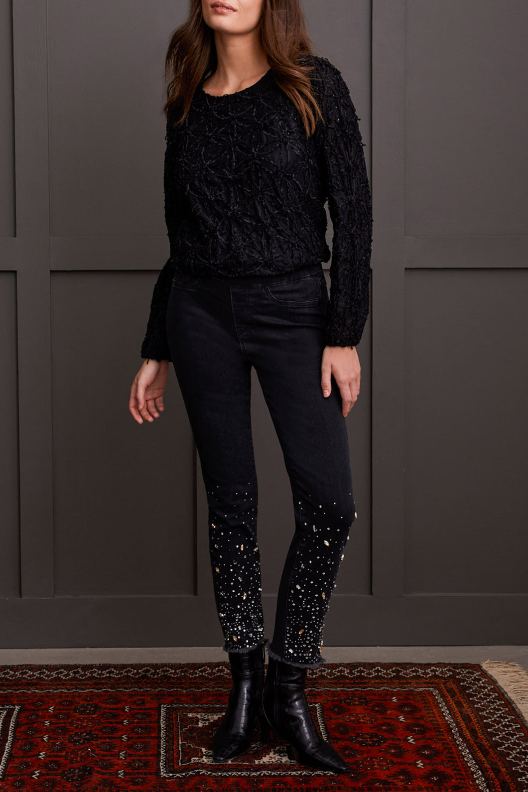 Elevate your style with glamorous gemstone accents on the striking black Audrey Pull-On Slim Jean. Crafted for the contemporary woman, these jeans boast a smooth pull-on design, free from zippers or buttons, for a seamless and flattering silhouette. The slim-leg cut accentuates your figure, offering a flexible and chic option for your clothing collection