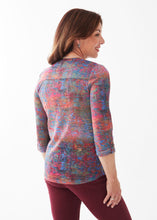 Load image into Gallery viewer, Enjoy hues of autumn shades on this beautiful French Dressing Henley top. Ideal for a crisp fall morning, wear this gorgeous top alone or layer under a favorite jacket.    Colors- Autumn Reflection- blue, orange, yellow, green, red. Henley neckline. Antique silver button hardware. Tab 3/4 sleeve. 100% Polyester
