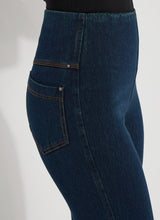 Load image into Gallery viewer, The Ankle Denim Baby Bootcut, with its 27-inch length and subtle leg flare, is the perfect pant for petite women. Crafted from 4-way stretch Knit Denim, these ankle-length bootcut pants feature a concealed patented waistband, rear patch pockets adorned with metal grommets, and anatomical seaming for a lifting and contouring effect. The jeans gracefully skim the hips and thighs, leading to a gently flared bootcut leg opening.
