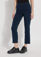 Load image into Gallery viewer, The Ankle Denim Baby Bootcut, with its 27-inch length and subtle leg flare, is the perfect pant for petite women. Crafted from 4-way stretch Knit Denim, these ankle-length bootcut pants feature a concealed patented waistband, rear patch pockets adorned with metal grommets, and anatomical seaming for a lifting and contouring effect. The jeans gracefully skim the hips and thighs, leading to a gently flared bootcut leg opening.
