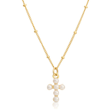 This Baby Vivi Charm Necklace is a mini version of our best-selling Vivian Cross Necklace, using pearls to create the cross hanging from our dainty 14k gold-filled chain which keeps it cute and light. The perfect soft necklace is able to stand alone and keep it simple, or stack with our other beautiful pearl styles.  Color- Gold and white. White pearls. 14K gold filled chain. 16-inch chain.