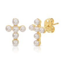 Load image into Gallery viewer, hese Baby Vivi cross studs are perfect earrings. Large enough to stand out but delicate with its pearl detail, these earrings give you that extra pop to your wardrobe.  Color- White and gold. White pearls.  14k gold plated.
