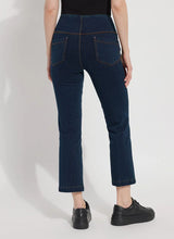 Load image into Gallery viewer, The Ankle Denim Baby Bootcut, with its 27-inch length and subtle leg flare, is the perfect pant for petite women. Crafted from 4-way stretch Knit Denim, these ankle-length bootcut pants feature a concealed patented waistband, rear patch pockets adorned with metal grommets, and anatomical seaming for a lifting and contouring effect. The jeans gracefully skim the hips and thighs, leading to a gently flared bootcut leg opening.
