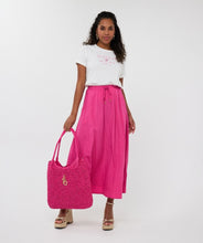 Load image into Gallery viewer, The EsQualo Bodil Bag is a chic and versatile handbag featuring two carrying options—a long adjustable strap with the EsQualo name for a stylish crossbody look, and shorter handles for a classic hand-carry option. Designed for both fashion and function, this bag adds a bold pop of hot pink to any outfit while offering plenty of room to carry all your essentials.
