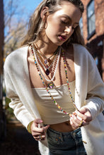 Load image into Gallery viewer, Show off your individuality with the Be Free Necklace! Made of gold plated brass, polished pearls, and colorful enamel, this fashionable piece measures 16&quot; with a 3&quot; extension and adds a touch of flair to any outfit. Crafted in Canada, this necklace is the perfect way to express yourself! Color- Gold, white, red, orange, yellow, pink, blue. Gold plated brass. Polished pearls. Length- 16 inch with 3 inch extension.
