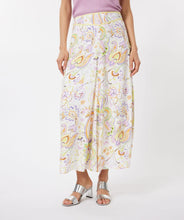 Load image into Gallery viewer, Gorgeous eye-catching spring/summer colors just pop on this stunning skirt by EsQualo.  With its feminine design, you will feel so pretty when you wear this beauty to luncheons with friends, garden/pool parties or evening events.    Colors- Shades of greens, purples, orange, touch of brown on a white background. Whimsical floral print. Fully lined. Side zipper closure. Back elastic waist. Fabric -100% Viscose.
