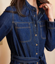 Load image into Gallery viewer, Close-up of a woman wearing a blue denim dress against a neutral background.
