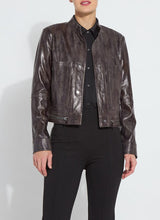 Load image into Gallery viewer, This fitted true-to-size moto jacket, crafted from 4-way stretch Patent Foil Vegan Leather, features an engineered Liquid Mocha Snake pattern, patch pockets, and chunky gunmetal zippers. This exceptionally beautiful jacket boasts a striking appearance that is certain to garner compliments.
