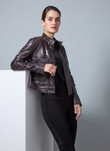 Load image into Gallery viewer, This fitted true-to-size moto jacket, crafted from 4-way stretch Patent Foil Vegan Leather, features an engineered Liquid Mocha Snake pattern, patch pockets, and chunky gunmetal zippers. This exceptionally beautiful jacket boasts a striking appearance that is certain to garner compliments.
