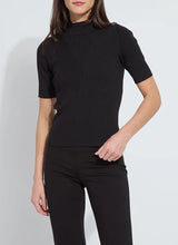 Load image into Gallery viewer, Model wearing black chevron ribbed elbow sleeve top and black pants against a white background.
