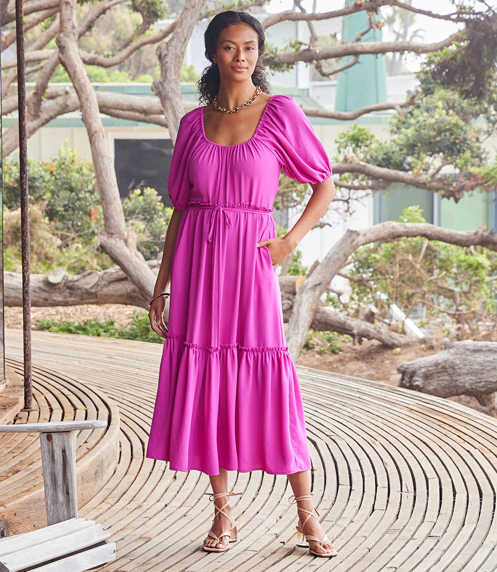 Featuring a ruffled tier and tie at the waist for figure-flattering shape, this relaxed peasant-style dress is rendered in a vibrant berry hue. The long silhouette offers an elegant design. Color-  Berry. Scoop neck. Side pockets. Tie waist. Fabric - 100% Polyester.