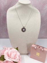 Load image into Gallery viewer, A stunning blue Coco Chanel button with gold lettering fancifully sits in a gorgeous sparkling silver base with twinkling crystals.&nbsp; This brilliant pendant hangs beautifully from a sparkling 925 silver diamond cut chain and&nbsp;is a modern take on a vintage piece. This beauty you will be proud to show off!&nbsp;
