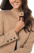 Load image into Gallery viewer, Woman wearing a camel-colored jacket over a black top and plaid pants against a white background.
