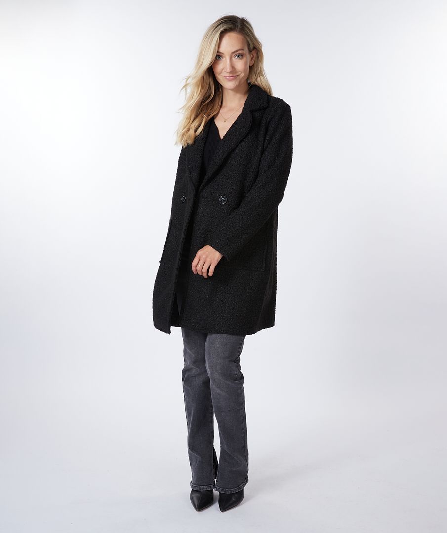 This jacket provides a unique combination of professional and casual style. The boucle texture gives it a cozier, more relaxed look. It's sophisticated yet chic, modern with a streamlined look. A timeless choice for any wardrobe.  Color -Black. Long length. Boucle. Button front closure. Front functional pockets. Fabric- 100% Polyester.