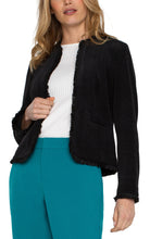 Load image into Gallery viewer, Our collarless jacket with frayed edges is the epitome of chic sophistication. This jacket is designed to be a standout piece in your wardrobe, effortlessly combines classic tailoring with modern details. The feel of this exceptional jacket is velvety soft and of high quality. Whether you&#39;re dressing up for a business meeting or adding a bit of flair to your casual ensemble, this collarless jacket is incredibly versatile.
