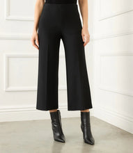 Load image into Gallery viewer, These versatile pants feature a cropped wide leg with a comfortable fit, plus plenty of stretch for ease of wear and shape maintenance. An elasticized waistband ensures easy pull-on dressing. A stylish pant when paired with your favorite boot or sandal.  Color- Black. Wide-leg. Elasticized waistband.
