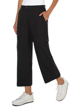 Load image into Gallery viewer, The Black Hi-Rise Cargo Crop Straight Pant by Liverpool Los Angeles have a straight leg design and cargo pockets, with added comfort from the back elastic waistband. Combine with your go-to sneakers for a fashionable appearance.  Color- Black. Hi-Rise. Elastic back waistband. Slash side pockets. Back flap pockets with button closure. Cargo side pockets with button closure. Zip-fly with single button closure.

