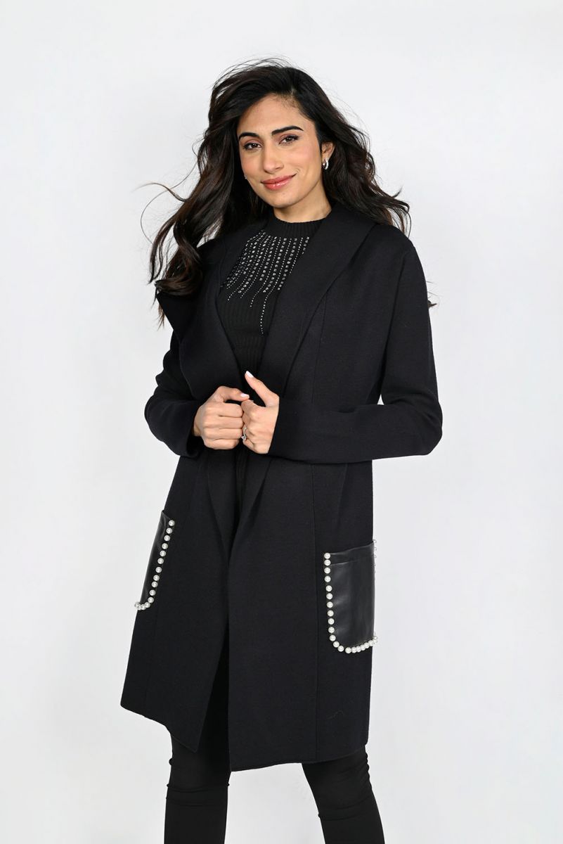 A stunningly unique piece, the Belen hooded cardigan adds a sophisticated finish to any look. Crafted with faux leather pockets and adorned with white pearl embellishments, it's guaranteed to turn heads.  Color- Black. Hood. Pearl embellishments. Faux leather pockets. Fabric -50% Rayon, 28% Polyester. 22% Nylon.