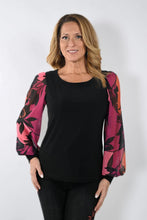 Load image into Gallery viewer, This Frank Lyman garment features a semi-sheer sleeve design in a bold magenta hue, adorned with an intricate floral pattern. Tailored with a stretchy fabric to provide a relaxed fit, the McKenna top pairs perfectly with jeans or trousers.    Pair with our Bettany Black and Magenta Painted Foral Denim Jean - Frank Lyman 233886U for a perfect look.  Color - Magenta, bright coral, pink and black. Billowy sleeves. Semi sheer sleeves. No pockets. No zipper.

