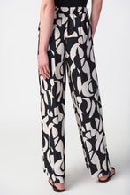 Load image into Gallery viewer, Crafted with flair and confidence in mind, these wide-leg pants are tailored from a lightweight woven fabric that gracefully moves with you. An eye-catching abstract print adds a touch of sophistication to this versatile garment, perfect for any occasion from day to night.  Color- Black/Moonstone. Abstract print. Covered elastic waistband. Unlined.
