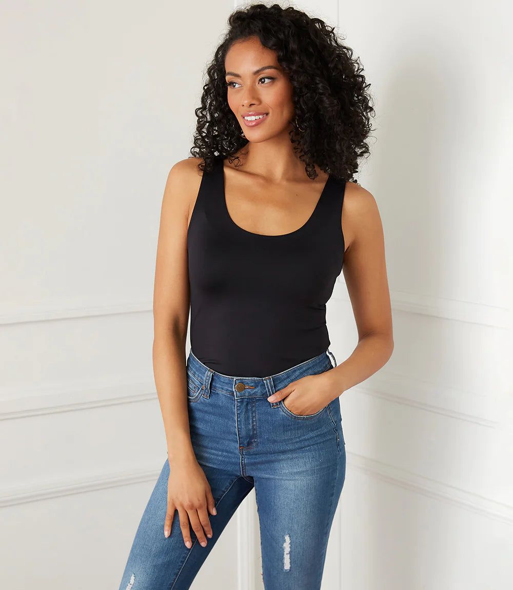 Indulge in the buttery softness of this essential tank. With its flattering scoop neck and super soft fabrication, this easy basic is a must-have staple. This tank is the perfect base for all your layering needs.  Color- Black. Sleeveless. Scoop neckline. Fitted. Fabric -92% Nylon. 8% Spandex.