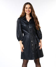 Load image into Gallery viewer, Uncover the ideal combination of sophistication and glamour with our &quot;Dress Short PU&quot;. Crafted from top-notch faux leather, the Betla dress brings a fashionable and daring style to conjure a head-turning ensemble. A must-have for an effortlessly elegant and captivating appearance!  Color- Black. Button down. Self-tie. Collared. Three quarter elastic cuff sleeves. Blouson sleeve. Faux leather.
