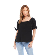 Load image into Gallery viewer, Our Bree top is an absolutely charming style, featuring a trend-right square neckline and billowy sleeves detailed with darling ties. A perfect complement to any bottom, you can easily transition from day to evening with this feminine top. Color- Black. Puff sleeve with ties. Square neck. Relaxed fit.
