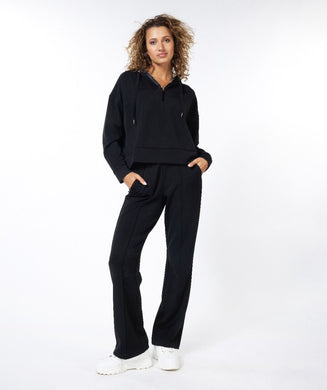 Crafted with high-quality modal material, EsQualo's Black Modal Flair Trousers offer exceptional comfort and a fashionable silhouette. With its flared legs, the trousers provide a dynamic and chic look. Plus, this piece promises lasting comfort throughout the day. A perfect style to wear casually or dress up.   Color- Black. Pull-on. Perfect stretch. Seams on front legs. Elastic waistband.