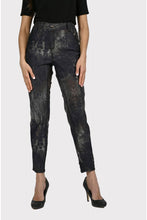 Load image into Gallery viewer, Experience maximum outfit versatility in these innovative two-in-one jeans. The reversible design features a classic animal print on one side and a solid black print on the reverse.  This fabulous denim pant is sure to become a wardrobe favorite! Color - Camel and black. Reversible design. Animal print on one side, solid black on the other. Fly front with belt loops. Perfect stretch and recovery. Fabric - 65% cotton. 33% polyester. 2% elastane. Hand wash cold water inside out. Hang to dry.
