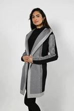 Load image into Gallery viewer, Look sharp in the Frank Lyman cardigan in black/grey striping. Crafted from a high-end fabric, this cardigan features beautiful sequin embellishment, slash pockets, and a stylish hoodie - a perfect addition to your wardrobe for any occasion.  Color- Grey and black. Side functional pockets. Hood. Fabric- 50% Rayon. 28% Polyester. 22% Nylon.
