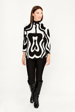 Load image into Gallery viewer, This amazing jacket features a bold abstract print in classic black and white colors.  Designed with three quarter sleeves and collarless neck, this modern Frank Lyman design offers a professional and vogue look.  Wear it on its own, or over a dress, cardigan, or top for a stylish look This brilliant style is perfect for the office, a social event, or a night out.  Color- Black and white. Square button down. No pockets. Abstract print. Three quarter sleeves. Slight stretch fabrication.
