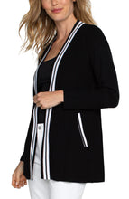 Load image into Gallery viewer, This black open front cardigan boasts a luxurious softness and a refined contrasting white trim. For a polished ensemble, pair it with a classic tee or complement it with the matching Sherese Sleeveless V-Neck Sweater featuring a coordinating contrast trim.  Color-Black and white. Open Front. Long sleeve. Contrasting trim. 12 Gauge Rib.
