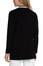 Load image into Gallery viewer, This black open front cardigan boasts a luxurious softness and a refined contrasting white trim. For a polished ensemble, pair it with a classic tee or complement it with the matching Sherese Sleeveless V-Neck Sweater featuring a coordinating contrast trim.  Color-Black and white. Open Front. Long sleeve. Contrasting trim. 12 Gauge Rib.
