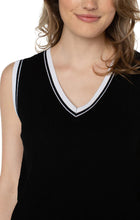 Load image into Gallery viewer, The Sherese Sleeveless V-Neck Sweater from Liverpool Los Angeles offers a luxurious black fabric with a comfortable and smooth texture. It includes a striking white ribbed accent for added style. For a trendy and coordinated look, pair it with the Oralia Open Front Contrast Trim Cardigan.  Color- Black and white. Sleeveless sweater. V-neck. Contrasting rib trim. 12 Gauge Rib.

