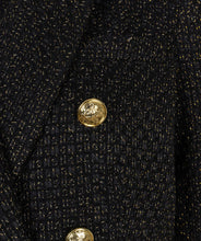 Load image into Gallery viewer, Elevate your style with the Brigida Boucle Blazer Long by EsQualo. The shimmering gold lurex and chic gold buttons add a touch of sophistication to this versatile piece, perfect for any wardrobe. Its classic boucle fabric provides both texture and warmth, while its long silhouette allows for effortless layering.
