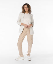 Load image into Gallery viewer, Elevate your fashion game with EsQualo&#39;s Sina Sand Blazer - a timeless and classic piece with smocked sleeves for a polished touch. Whether dressing up a casual spring outfit with jeans or adding refinement to a more formal look with trousers, this blazer exudes fashionable style.
