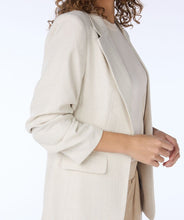 Load image into Gallery viewer, Elevate your fashion game with EsQualo&#39;s Sina Sand Blazer - a timeless and classic piece with smocked sleeves for a polished touch. Whether dressing up a casual spring outfit with jeans or adding refinement to a more formal look with trousers, this blazer exudes fashionable style.
