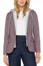 Load image into Gallery viewer, Woman wearing a patterned blazer with a hood, white shirt, and blue jeans on a white background.
