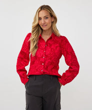 Load image into Gallery viewer, Featuring a raised floral pattern and a bold red hue, the Brandee Blouse 2tone Flower Jacquard by EsQualo is a must-have for those looking to make a statement. The thicker fabric is perfect for colder days, and can easily be dressed up with a skirt, trousers, or even your favorite denim. Don&#39;t miss out on leaving a lasting impression with this chic and unforgettable blouse.
